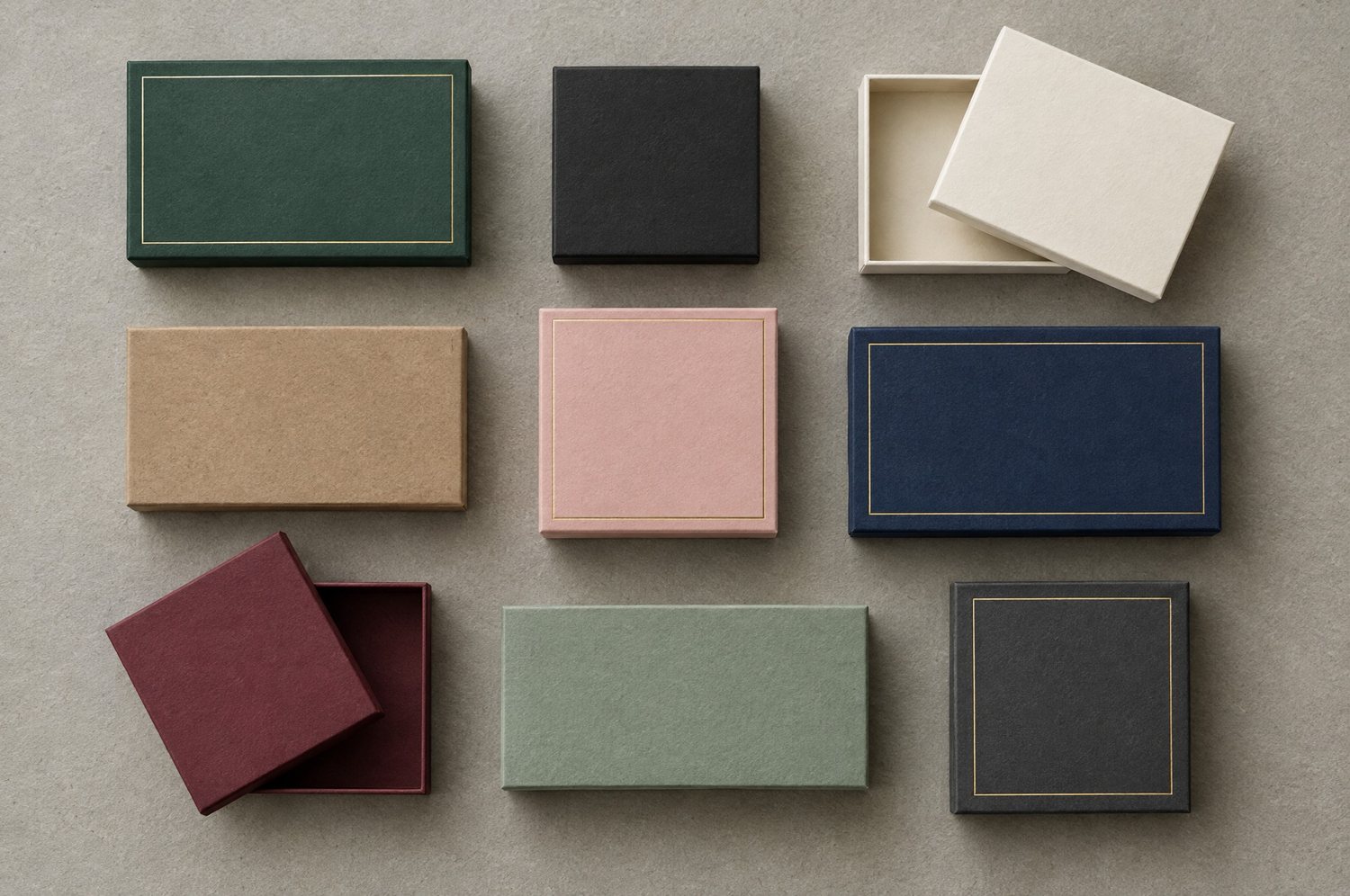 Nine rigid boxes in different sizes and colours laid out in a grid